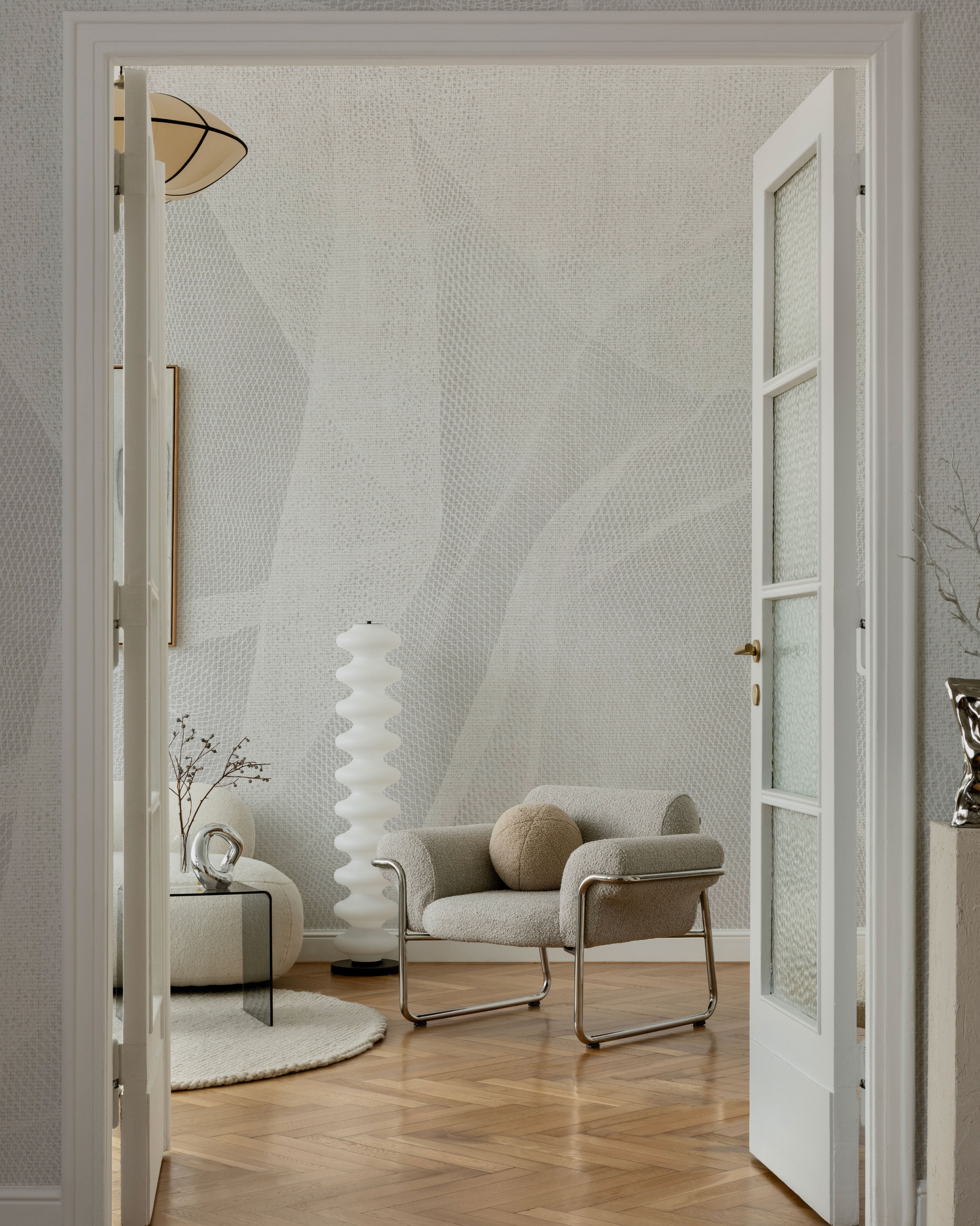 Neutral wallpaper with subtle geometric grid texture in light grey tones