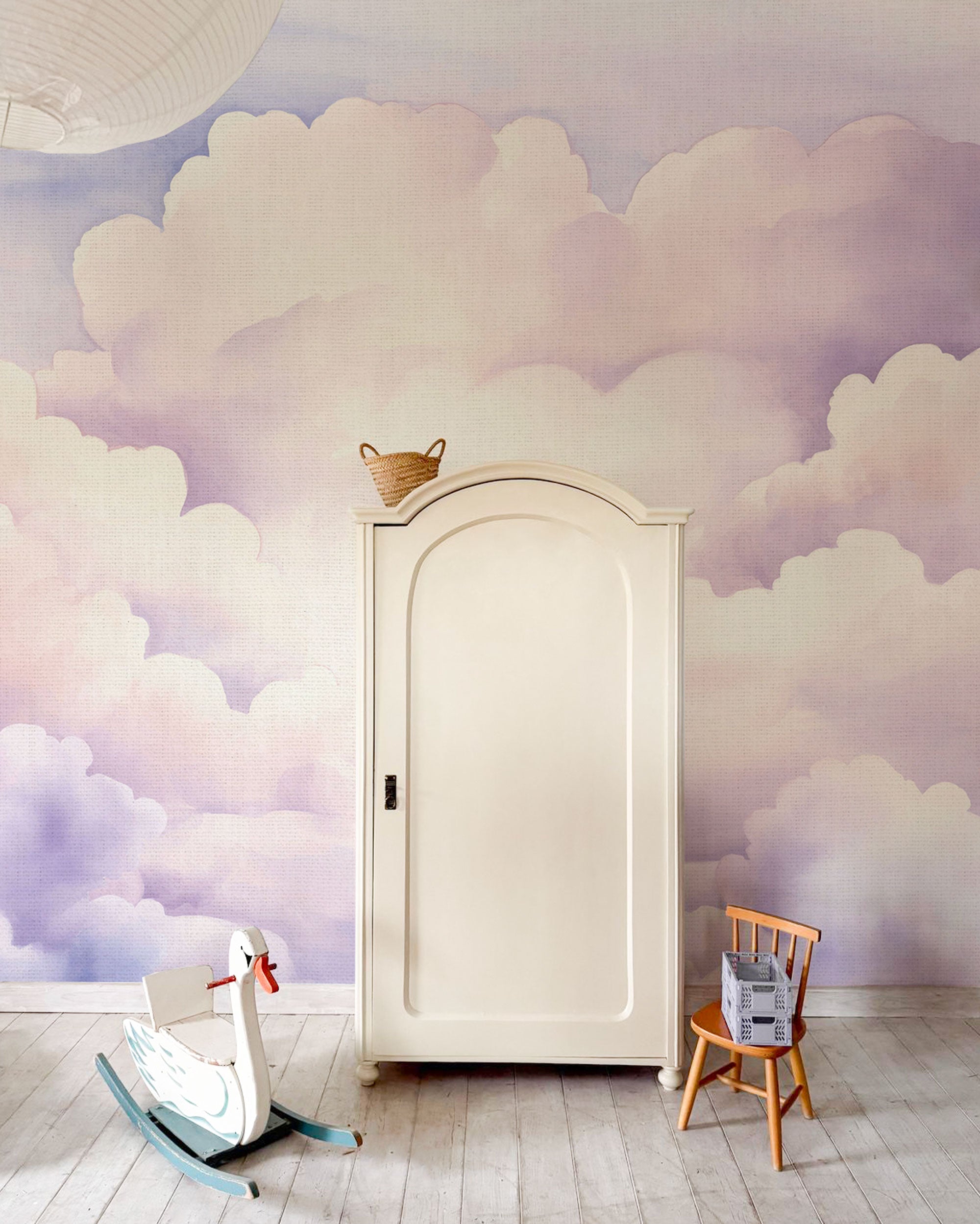 Pastel cloud pattern wallpaper in soft pink, lavender, and light blue watercolor tones