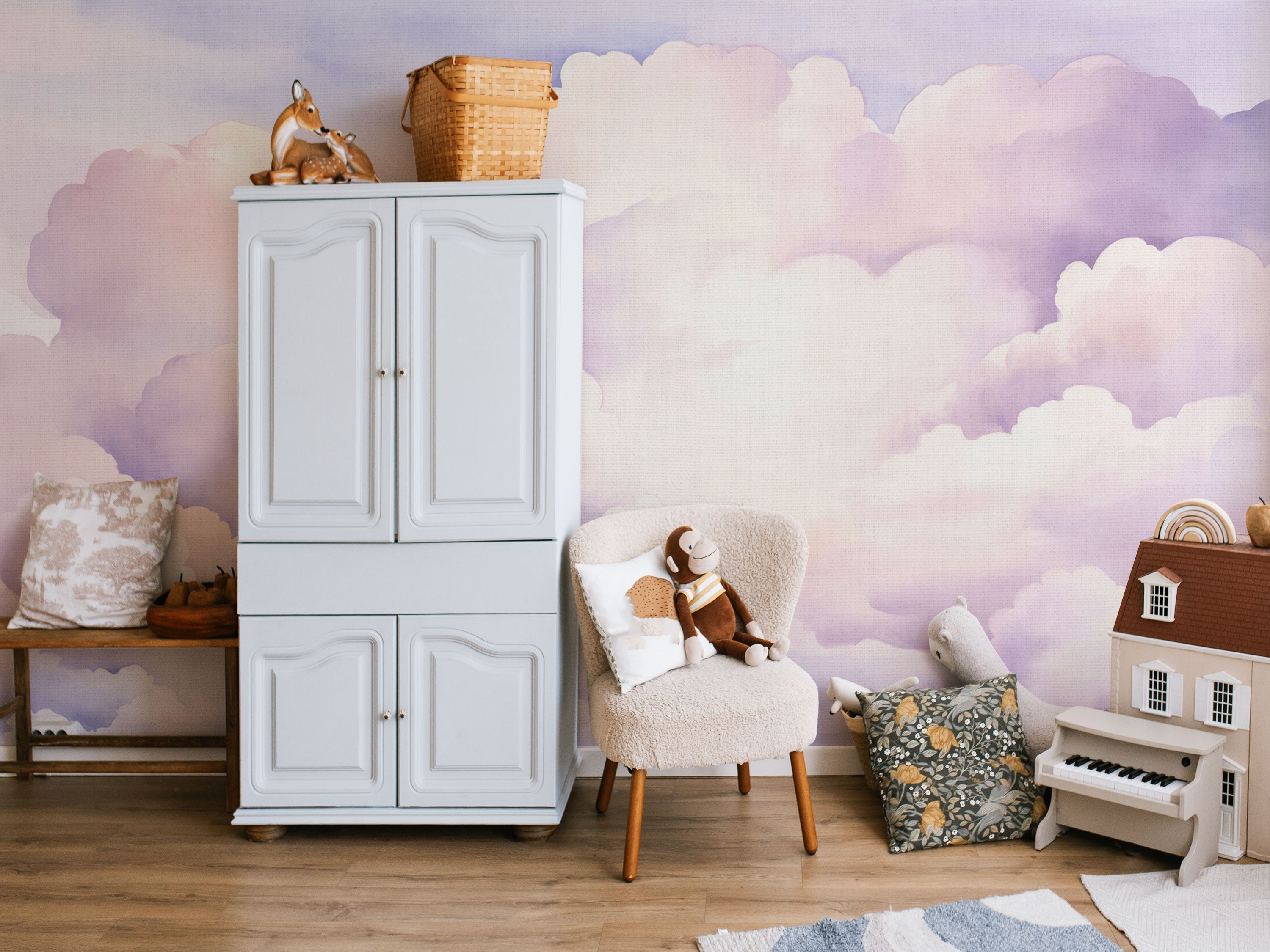 Pastel cloud pattern wallpaper in soft pink, lavender, and light blue watercolor tones