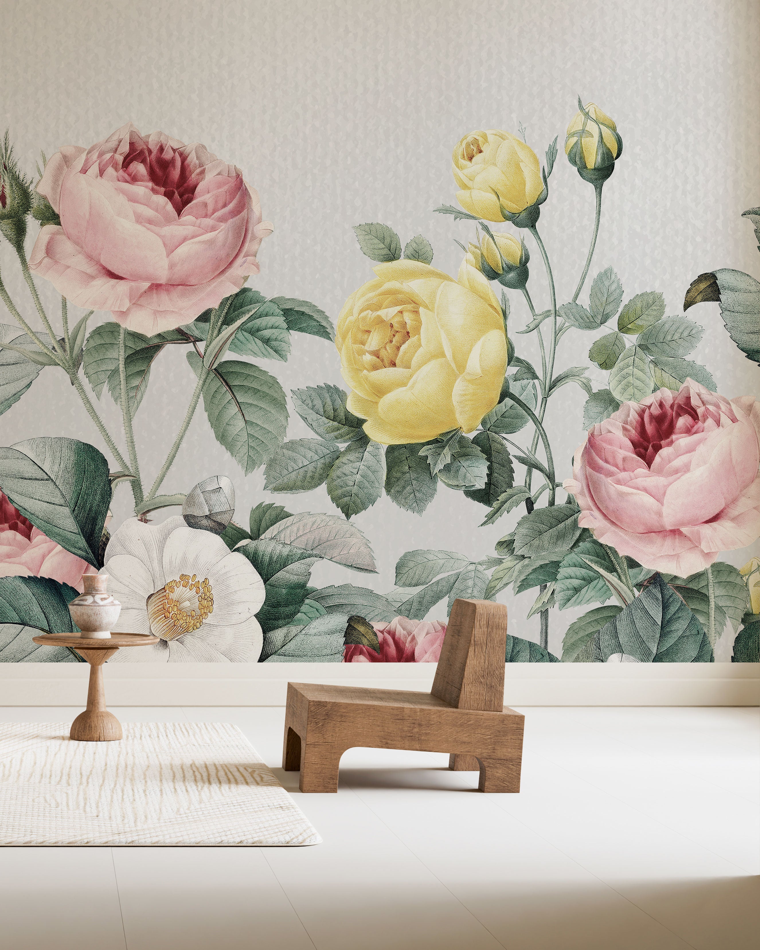 Vintage floral wallpaper with illustrated roses and blossoms in blush pink, pale yellow, creamy white, and muted green tones on a light textured background