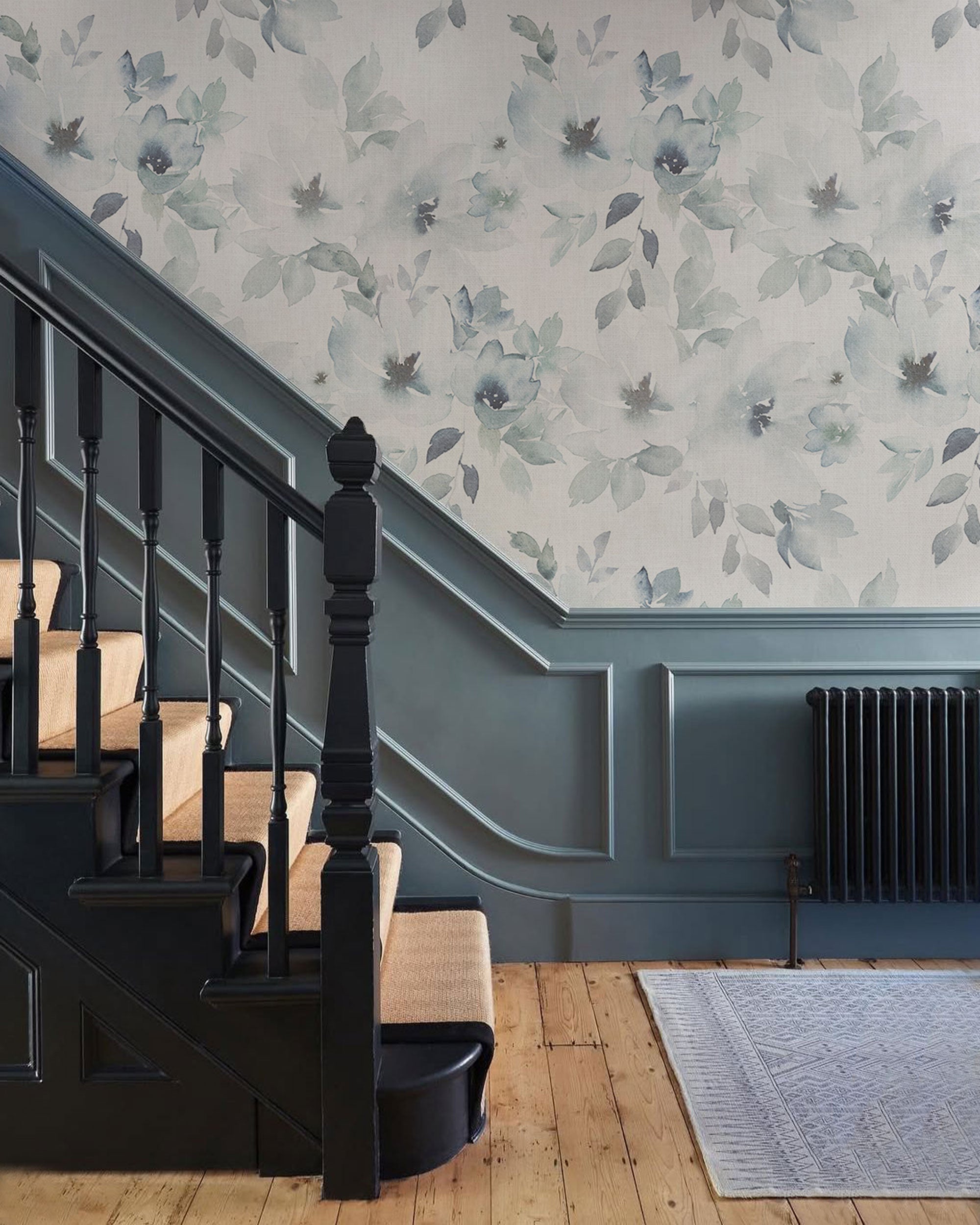 Soft blue floral wallpaper with watercolor flowers and leaves on a light background