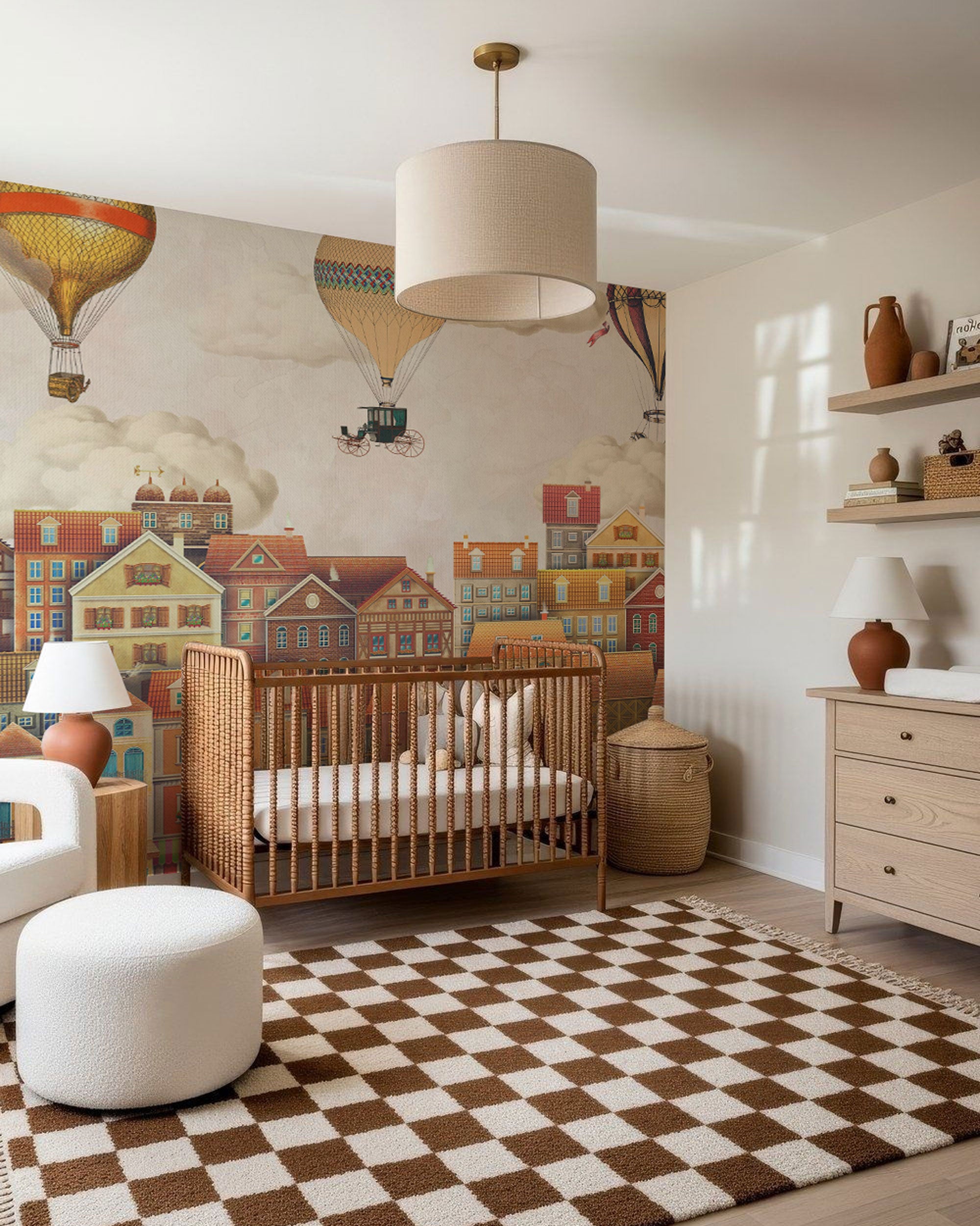 Kids mural wallpaper with vintage town houses and hot air balloons in soft pastel and warm neutral colors