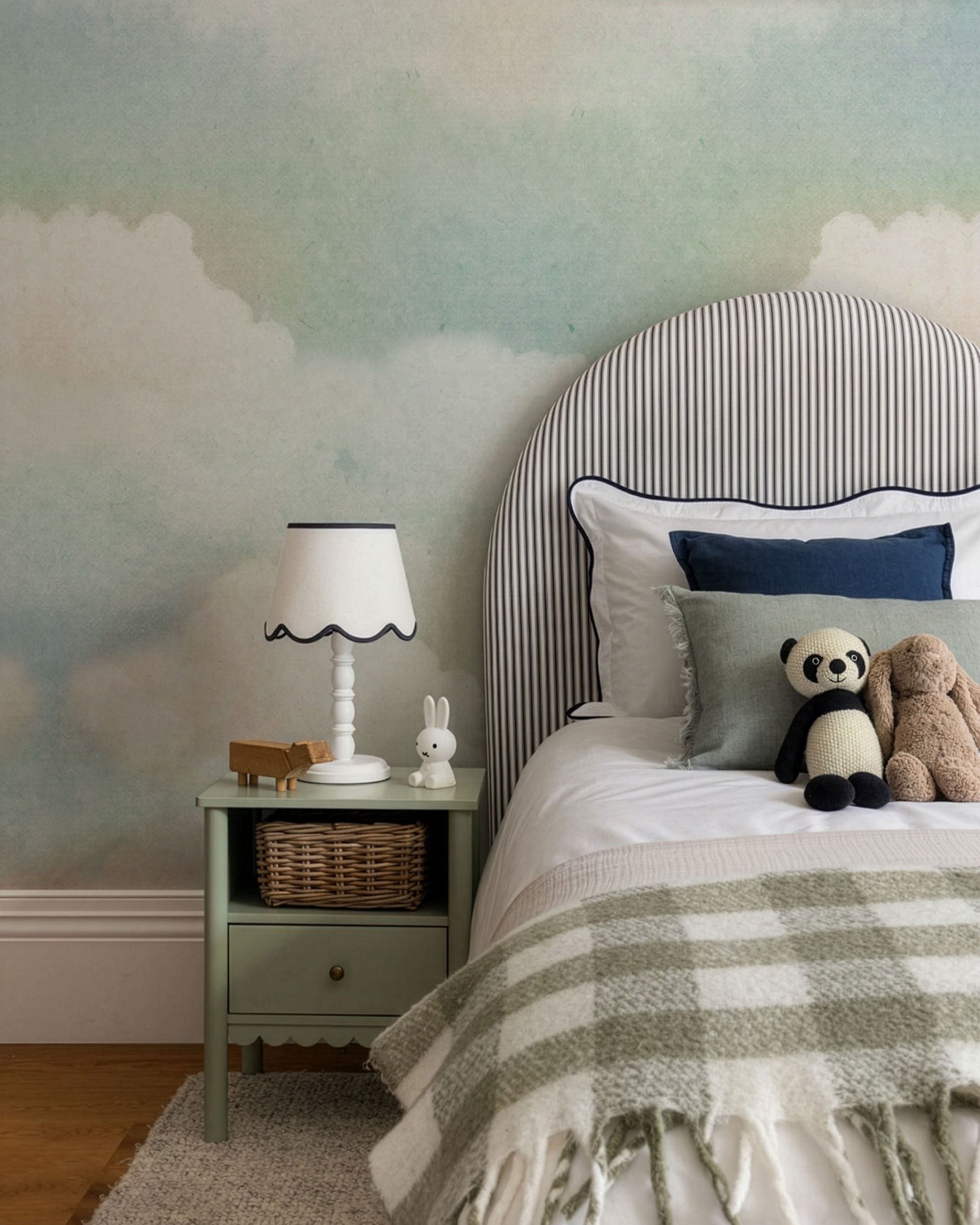 Soft watercolor cloud wallpaper in pastel blue and cream tones creating a calm, airy sky background