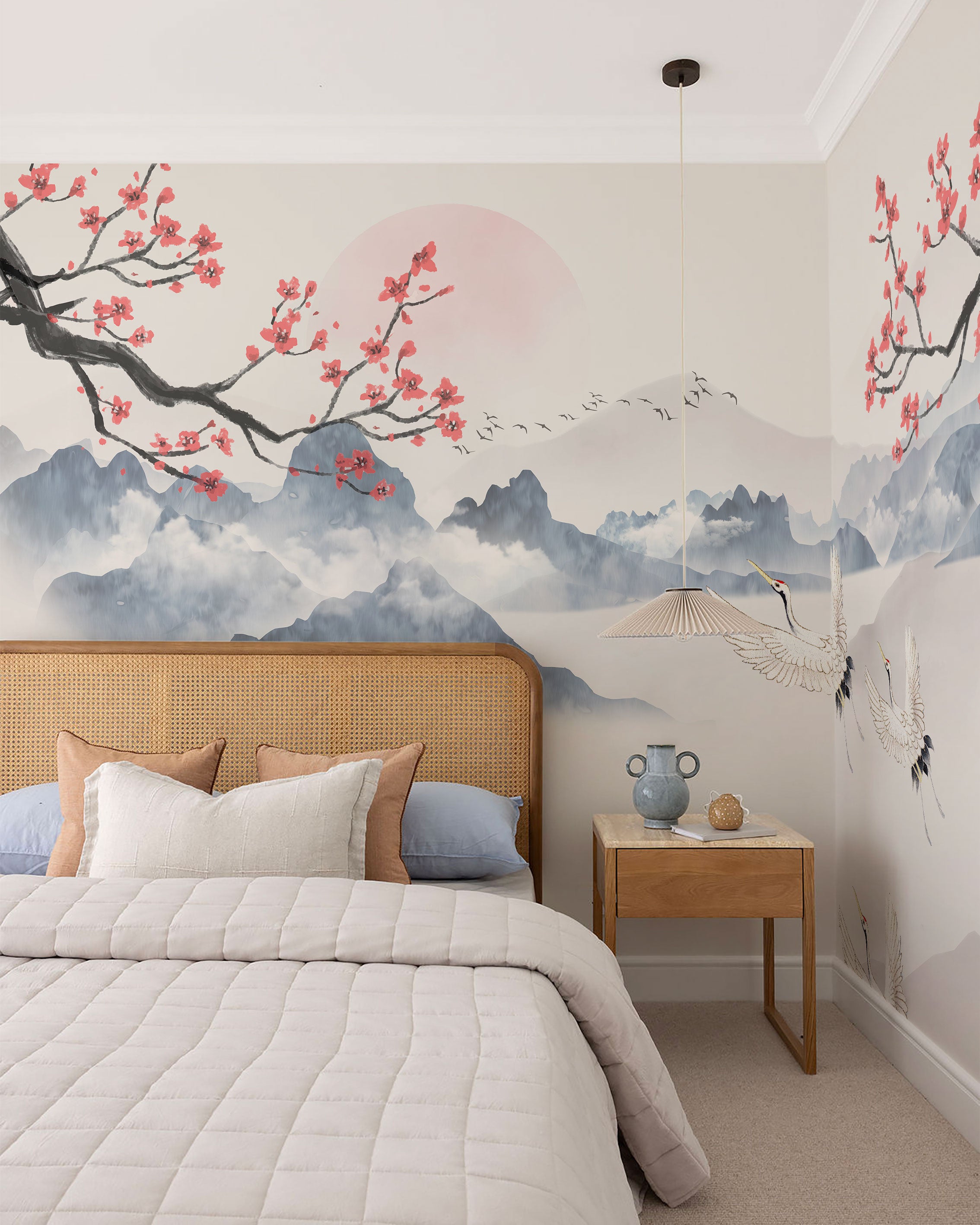 Japandi-style mural wallpaper with misty mountains, cherry blossom branches, and cranes in soft neutral tones