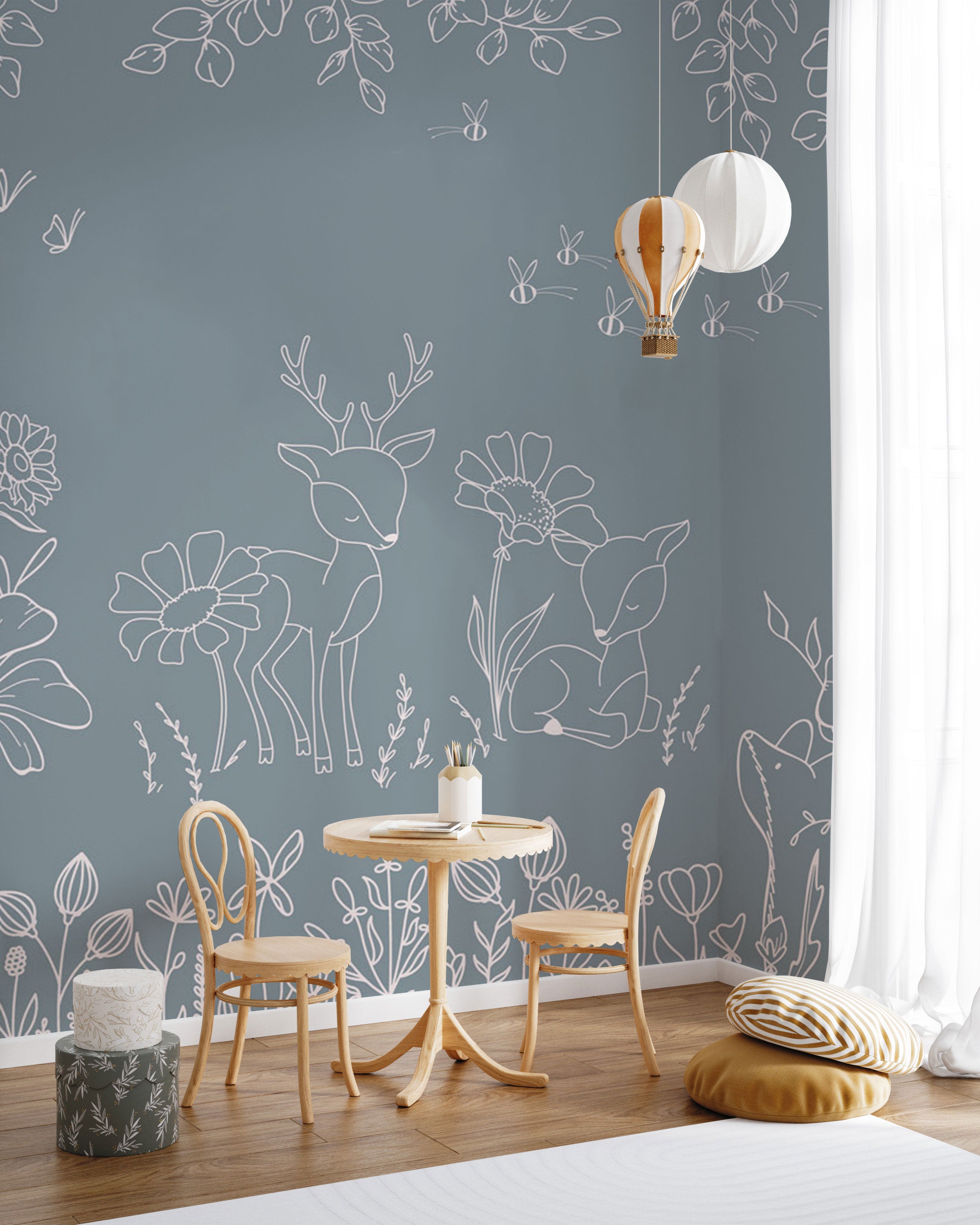 blue wallpaper with white line art deer, woodland animals and floral illustrations