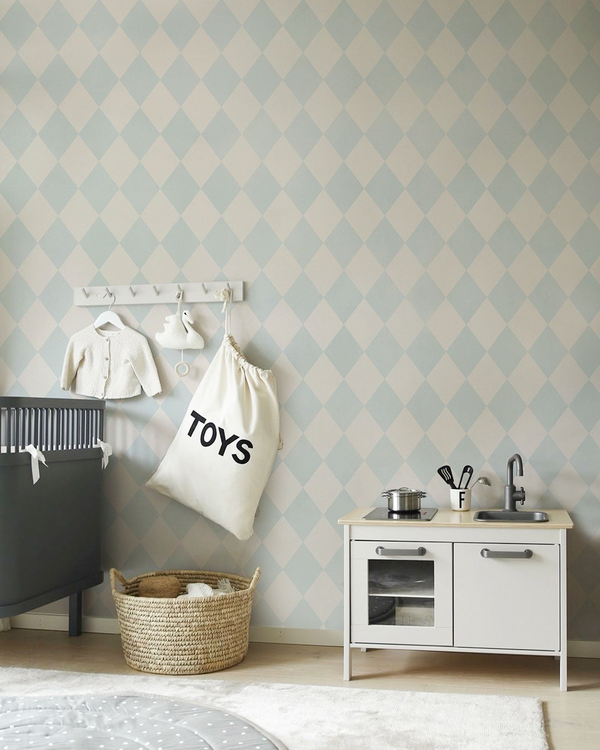 Soft blue and off-white rhomb pattern wallpaper with a light geometric rhythm and timeless design