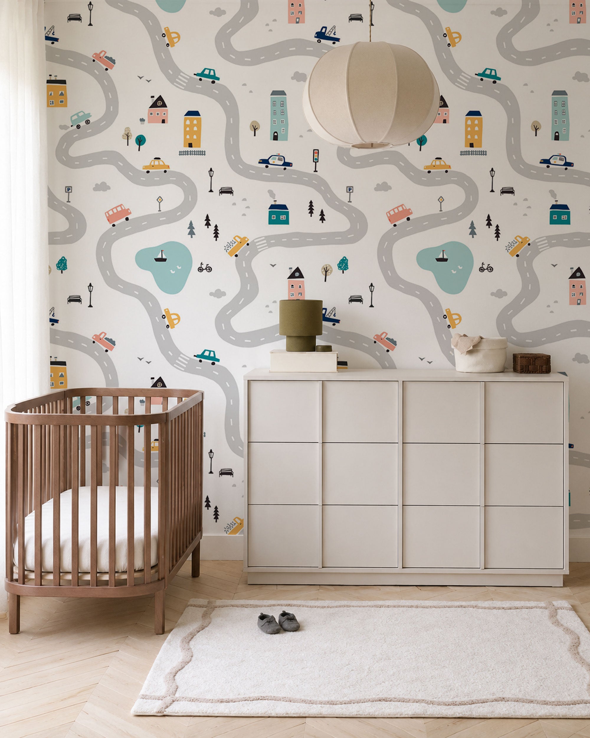 Kids wallpaper with illustrated city roads, houses and cars on light background