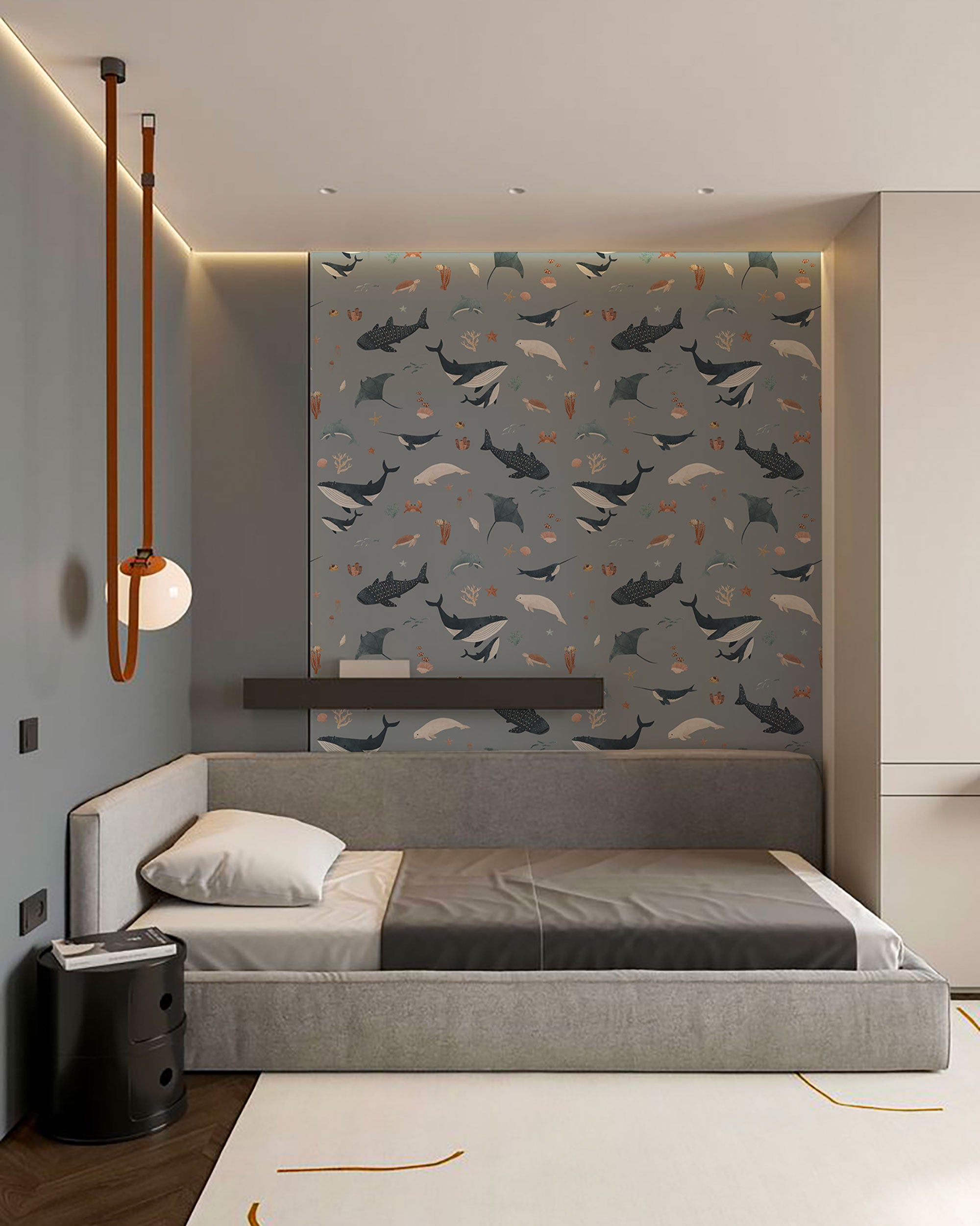 Blue grey ocean animals pattern wallpaper with whales, rays, dolphins, turtles, and sea motifs illustrated in soft muted tones.