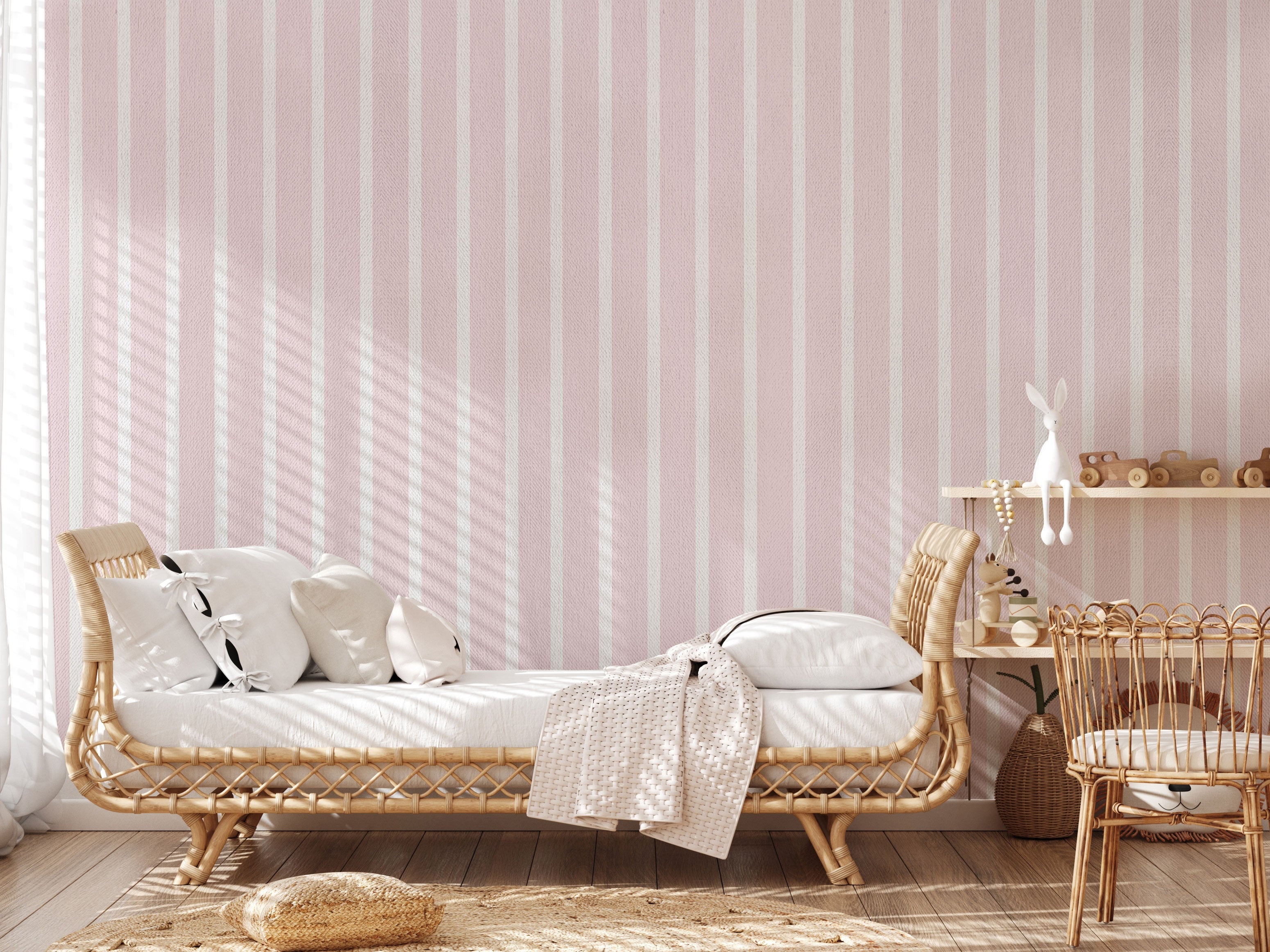 Soft pink and white vertical stripes pattern wallpaper with a subtle pastel texture.