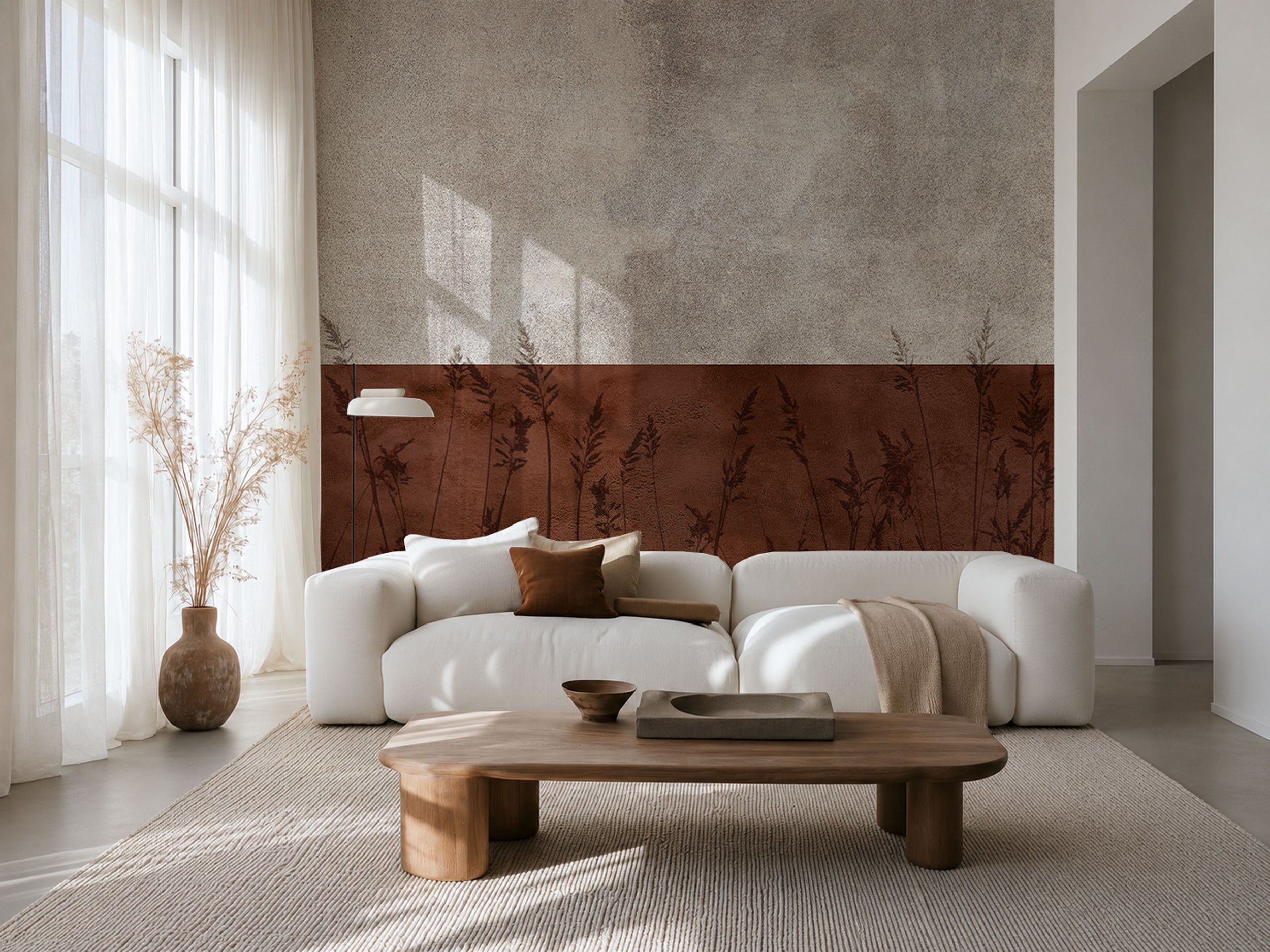 Textured mural wallpaper with a horizontal terracotta band and subtle grass silhouettes beneath a light stone-toned surface.